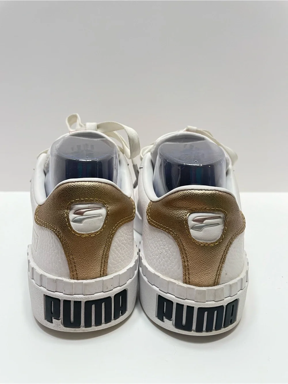 Women’s 7.5 Puma Cali Hacked White with gold and silver accents